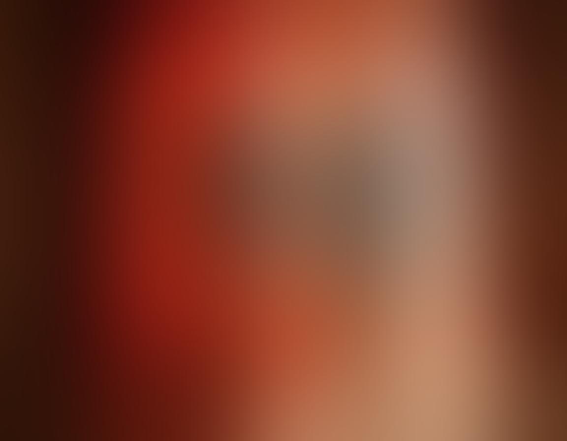 An enticing scene featuring a seductive silhouette behind a softly glowing curtain, hinting at adventure and allure. Vibrant red and gold tones create a warm atmosphere, with glimpses of abstract erotic art in the background. The setting is tastefully intimate, inviting viewers to explore deeper desires. Super-realistic. warm colors. soft textures.